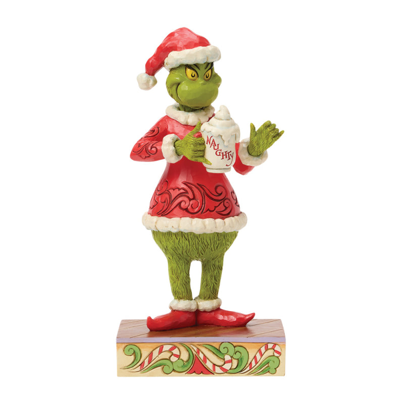 Jim Shore Grinch Figur 6018950 im Weihnachtsmannkostüm hält eine Tasse heiße Schokolade mit Sahne und der Aufschrift Naughty.