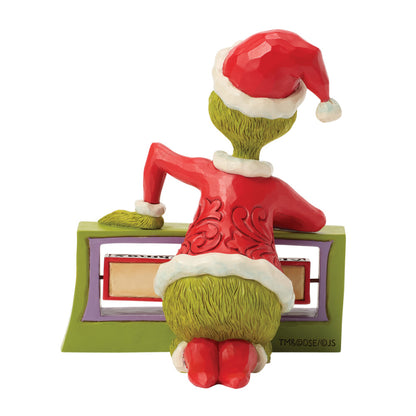Jim Shore Grinch. Interaktive Sammlerfigur mit drehbarem Schild von Enesco, Modell 6018960.Rückansicht