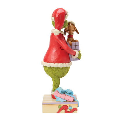 Jim Shore Grinch Figur mit Hund Max, der aus einem Geschenkpaket herausspringt, Modell 6018957.Seite Rechts