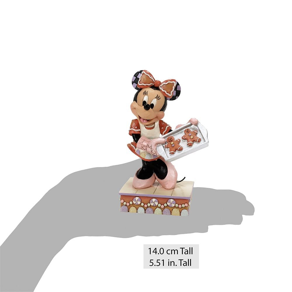 Größenvergleich der Minnie Mouse Sammelfigur auf einer Handfläche dargestellt.