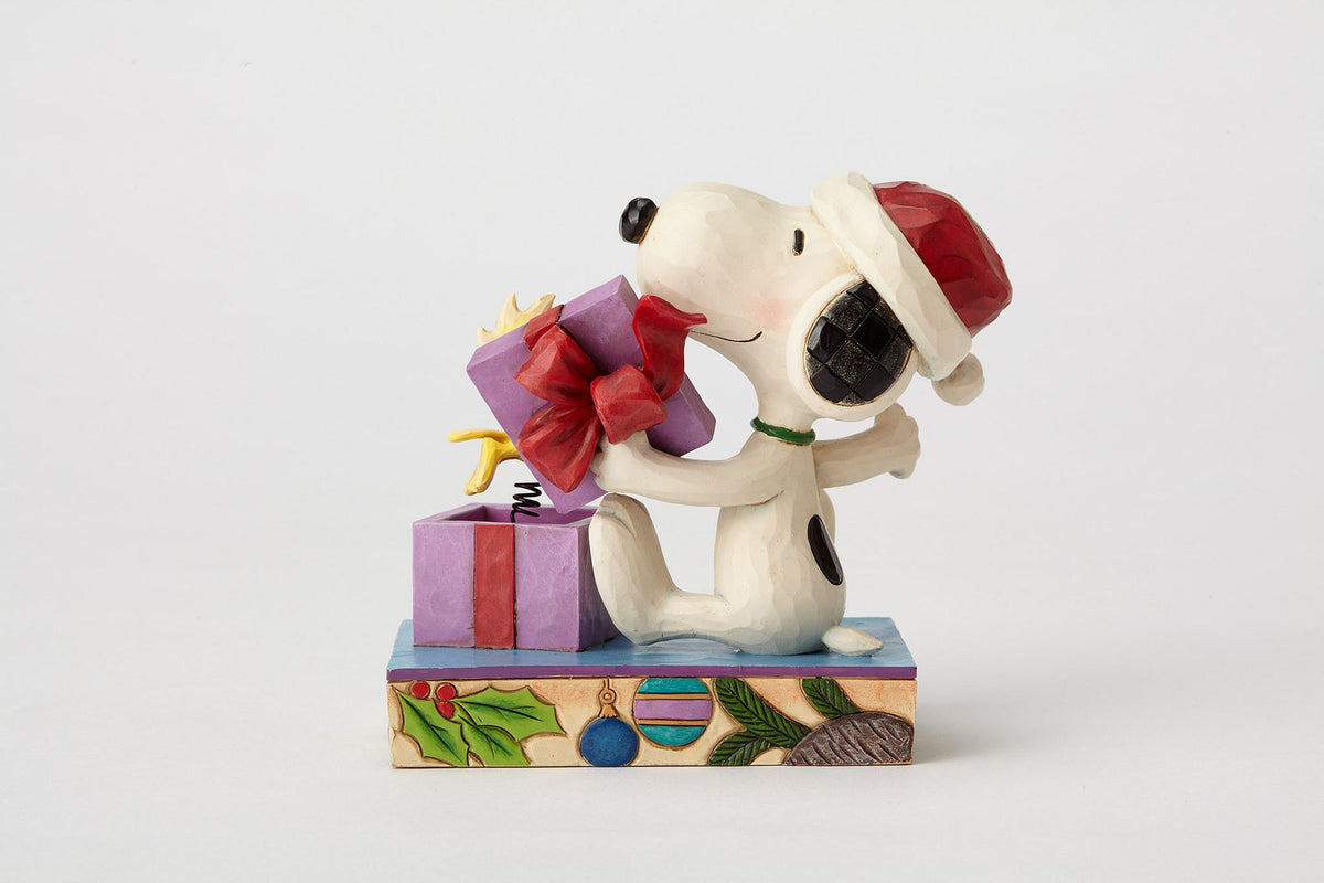 Festliche Weihnachtsdeko Peanuts by Jim Shore Figur Christmas Surprise mit Snoopy und Woodstock.