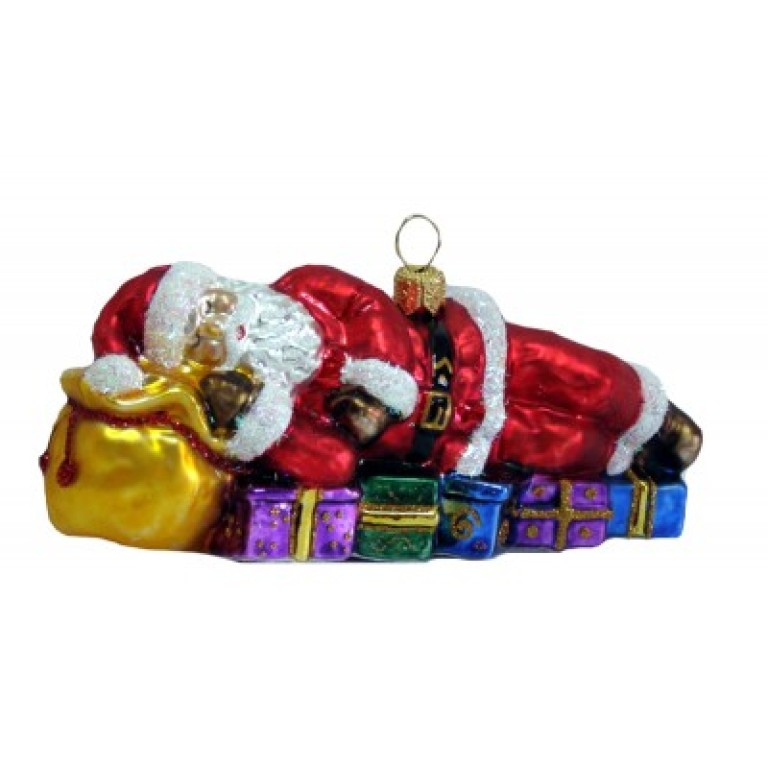 Christbaumschmuck Weihnachtsmann ruht auf seinen Geschenken